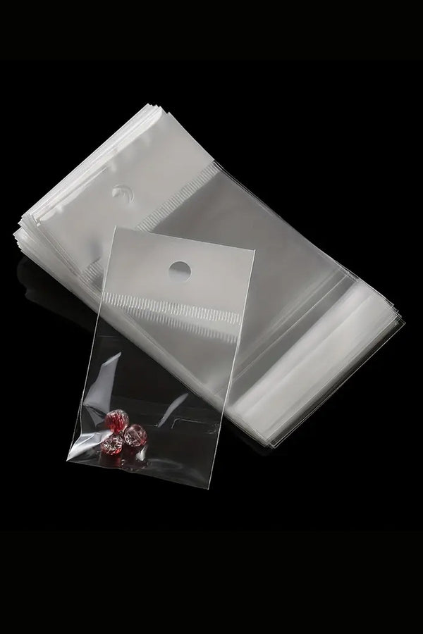 Şeffaf Opipi Jelatin Torba poşet  13×25 cm | Askılı, Yapışkanlı, 100 Adet – Telefon, Gözlük ve Aksesuar Ambalajı